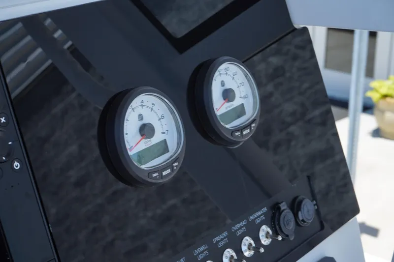 Slide: The Image of 2025 Blazer 2550 GTS boat dashboard with gauges and controls. - 21