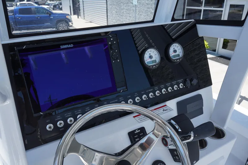 Slide: The Image of 2025 Blazer 2550 GTS boat dashboard with steering wheel and navigation system. - 23