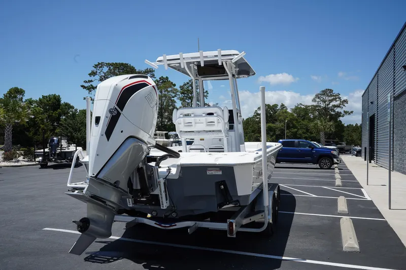 Slide: The Image of 2025 Blazer 2550 GTS boat with outboard motor in parking lot. - 5