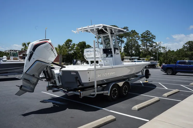 Slide: The Image of 2025 Blazer 2550 GTS boat on a trailer in a parking lot. - 6