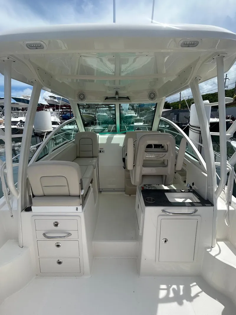 Slide: The Image of 2023 Boston Whaler 285 Conquest boat interior with seating and storage. - 3