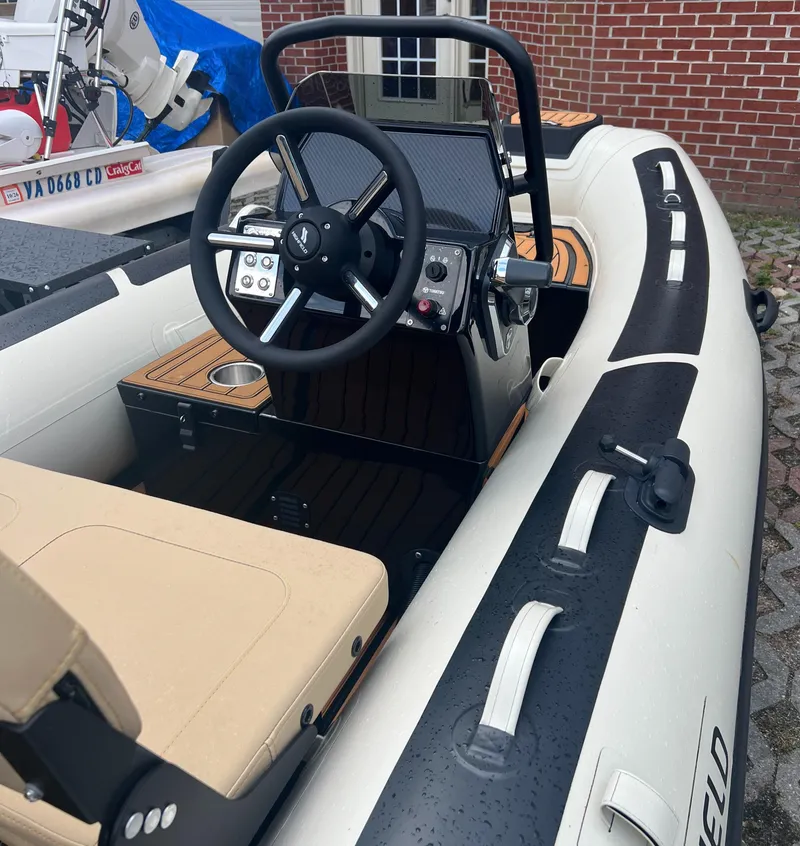 Slide: The Image of 2024 Highfield Classic 380 GT inflatable boat with steering console and seating. - 0
