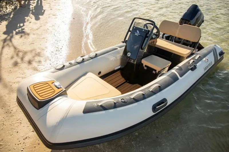 Slide: The Image of 2024 Highfield Classic 380 GT inflatable boat on sandy shore. - 4