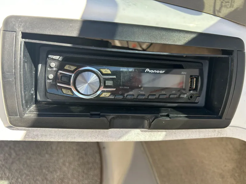 Slide: The Image of Pioneer stereo system in a 2007 Larson 180SEI LX boat dashboard. - 12