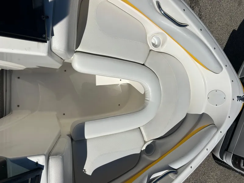Slide: The Image of 2007 Larson 180SEI LX boat interior with white seating and cup holders. - 9