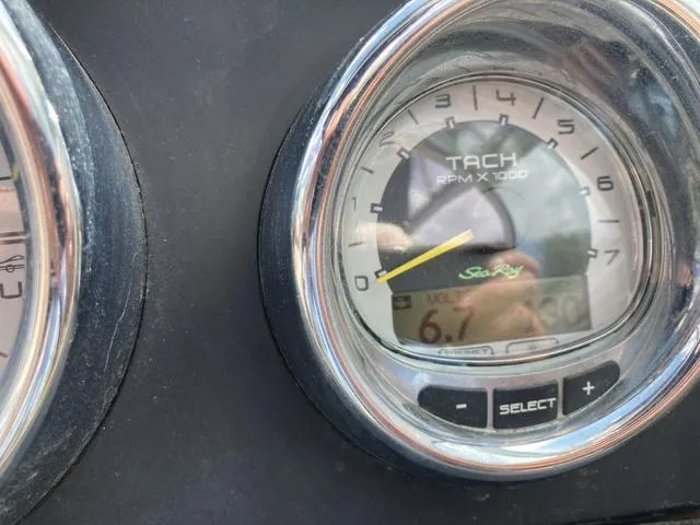 Slide: The Image of Close-up of 2011 Sea Ray 230 SLX tachometer showing RPM and voltage. - 16