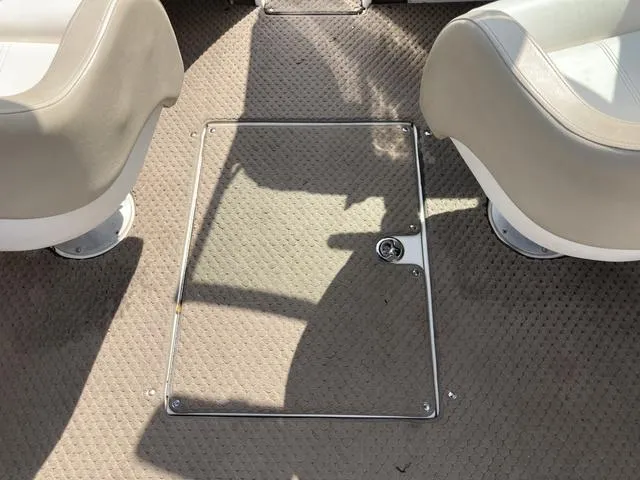 Slide: The Image of Interior floor of a 2011 Sea Ray 230 SLX boat with storage compartment. - 17