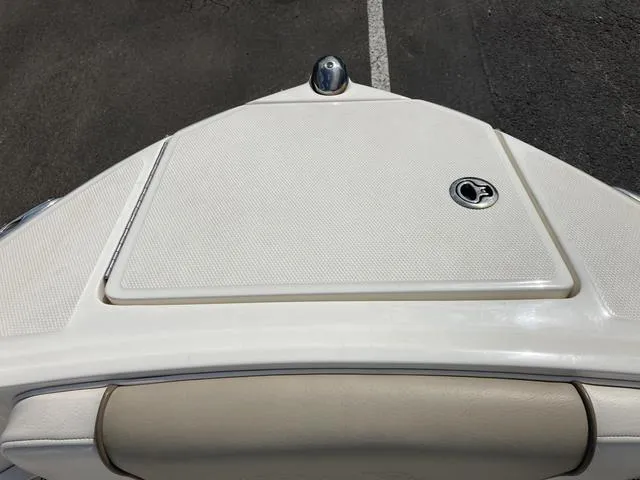 Slide: The Image of 2011 Sea Ray 230 SLX boat bow with storage compartment. - 19