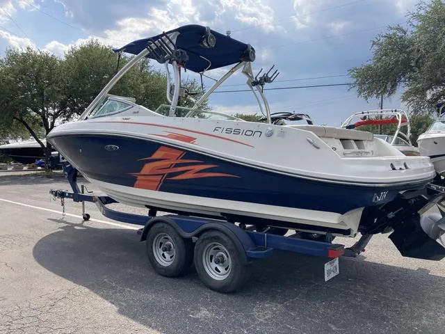 Slide: The Image of 2011 Sea Ray 230 SLX boat on trailer, side view, outdoors. - 4