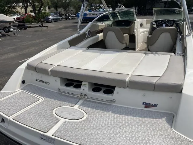 Slide: The Image of 2011 Sea Ray 230 SLX boat with spacious seating and swim platform. - 5
