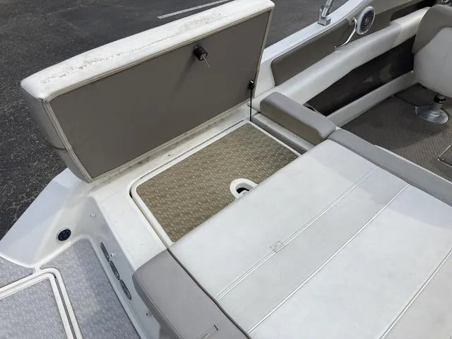 Slide: The Image of 2011 Sea Ray 230 SLX boat interior with open storage compartment. - 7