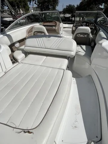 Slide: The Image of 2008 Cobalt 242 boat with white leather seating and open deck. - 16