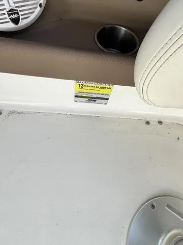 Slide: The Image of 2008 Cobalt 242 boat interior with capacity label for 13 people or 1900 lbs. - 18