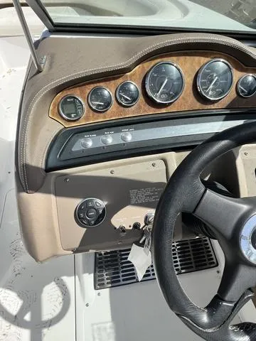 Slide: The Image of Dashboard of a 2008 Cobalt 242 boat with gauges and steering wheel. - 20