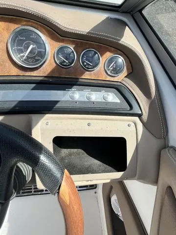 Slide: The Image of Dashboard of a 2008 Cobalt 242 boat with gauges and steering wheel. - 21