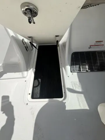 Slide: The Image of 2008 Cobalt 242 boat interior with open storage compartment. - 30