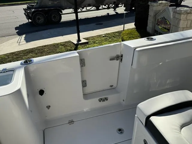 Slide: The Image of 2024 Robalo 360 boat interior, rear deck view with open hatch. - 17