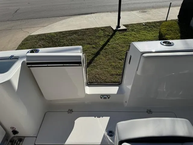Slide: The Image of 2024 Robalo 360 boat stern view with open transom door. - 18