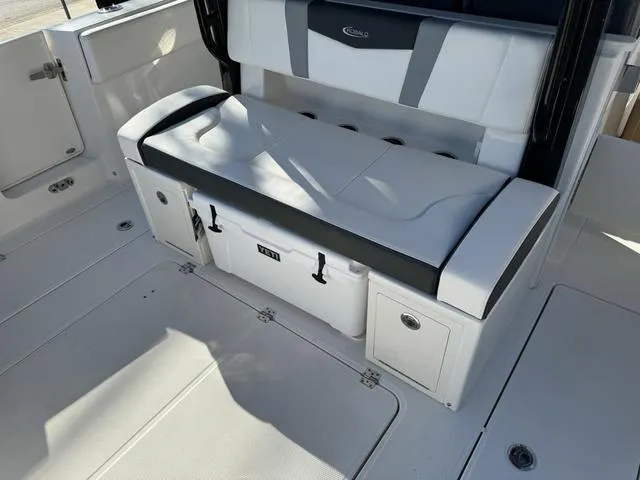 Slide: The Image of 2024 Robalo 360 boat interior seating and storage area. - 19