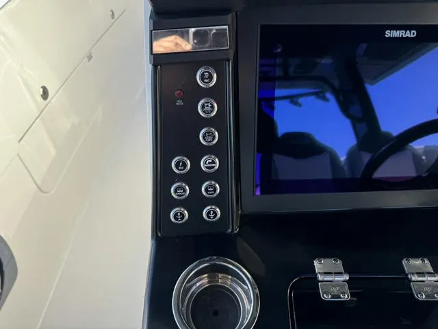 Slide: The Image of Control panel and display screen of 2024 Robalo 360 boat. - 28