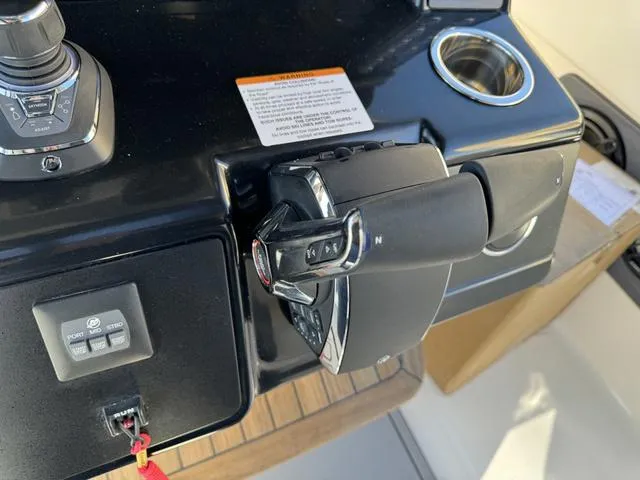 Slide: The Image of Control panel of a 2024 Robalo 360 boat with throttle and joystick. - 32