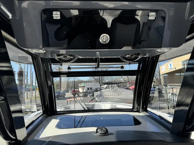 Slide: The Image of Interior view of 2024 Robalo 360 boat cockpit with modern controls and panoramic windows. - 34