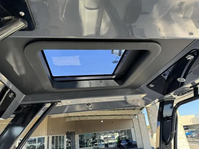 Slide: The Image of Robalo 360 2024 model boat roof with sunroof and exterior view. - 35
