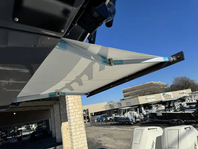 Slide: The Image of 2024 Robalo 360 boat with extended sunshade at a dealership. - 41