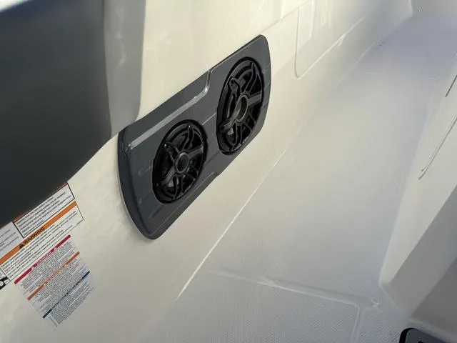 Slide: The Image of 2024 Robalo 360 boat interior with dual speakers. - 48
