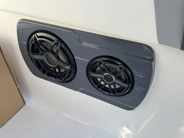 Slide: The Image of Dual speakers on a 2024 Robalo 360 boat. - 49