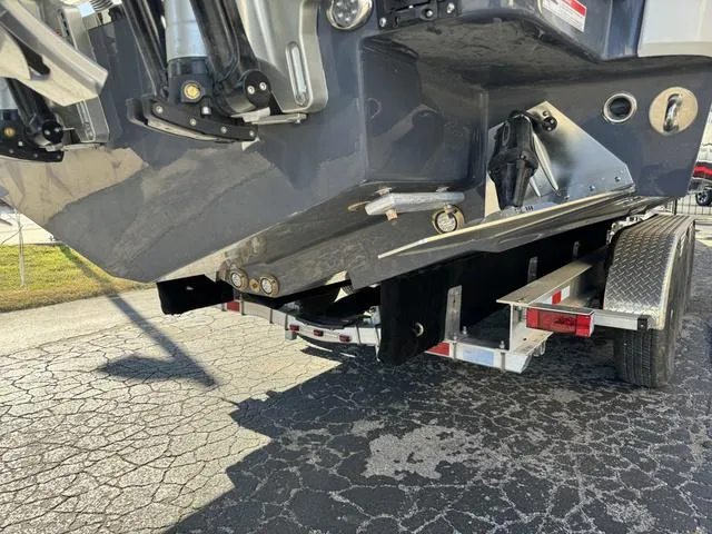 Slide: The Image of 2024 Robalo 360 boat on trailer, rear view showing outboard motors and hull. - 6