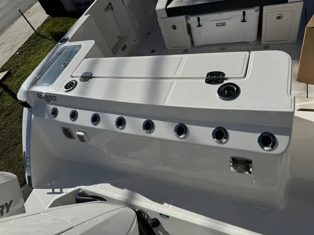 Slide: The Image of 2024 Robalo 360 boat deck with multiple rod holders and storage compartments. - 7
