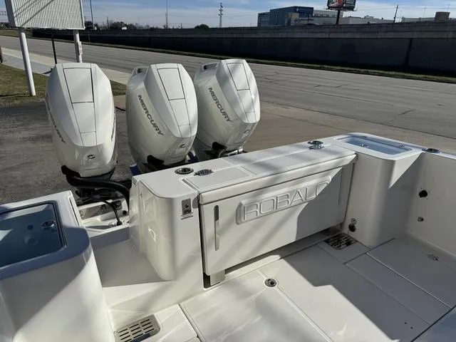 Slide: The Image of 2024 Robalo 360 boat with triple Mercury outboard engines. - 9