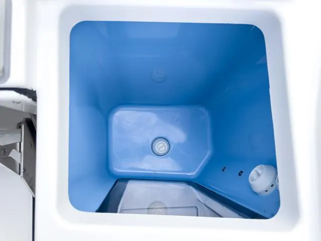 Slide: The Image of 2024 Blackfin 272 CC boat livewell with blue interior. - 14