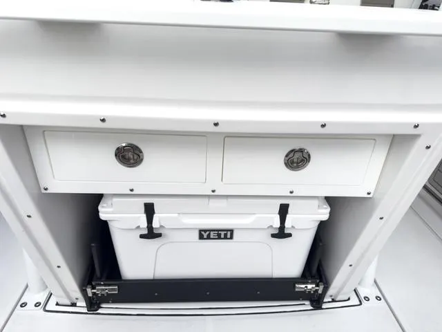 Slide: The Image of 2024 Blackfin 272 CC boat with Yeti cooler and storage drawers. - 15