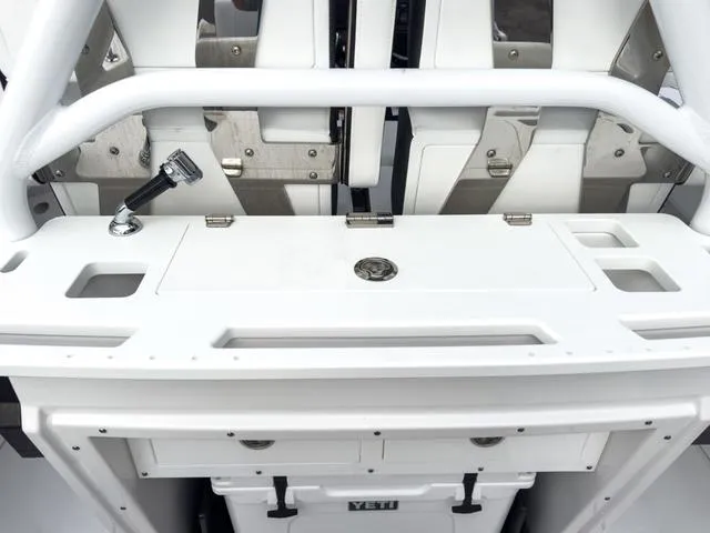 Slide: The Image of 2024 Blackfin 272 CC center console with Yeti cooler and rod holder. - 17