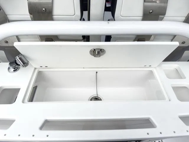 Slide: The Image of 2024 Blackfin 272 CC boat sink and storage compartment. - 18