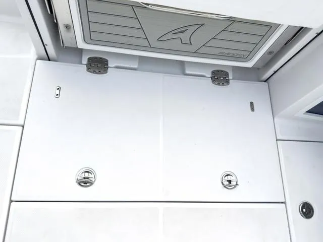 Slide: The Image of 2024 Blackfin 272 CC boat deck with storage compartments and stainless steel latches. - 21
