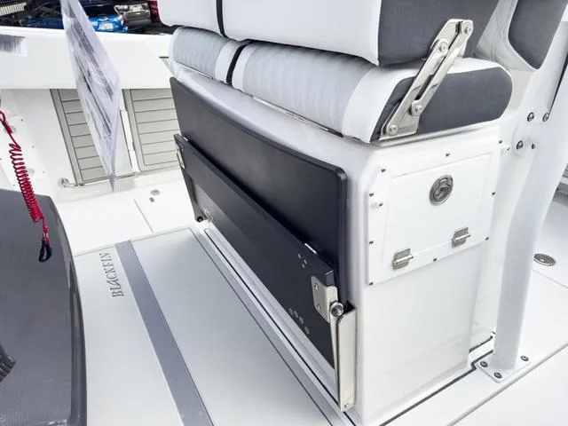 Slide: The Image of 2024 Blackfin 272 CC boat interior seating and storage compartment. - 27