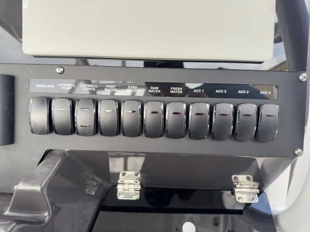 Slide: The Image of Control panel of a 2024 Blackfin 272 CC boat with labeled switches. - 31