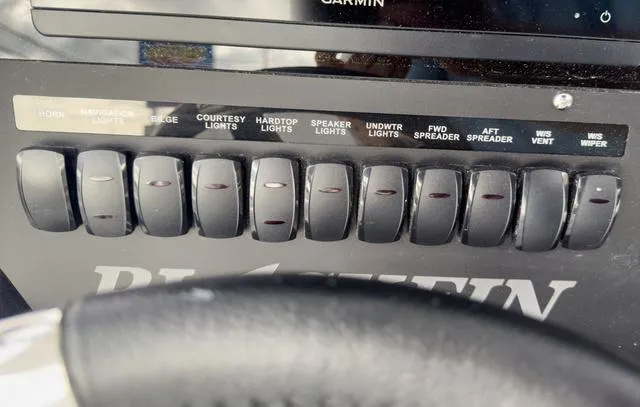 Slide: The Image of Control panel of a 2024 Blackfin 272 CC boat with labeled switches. - 33