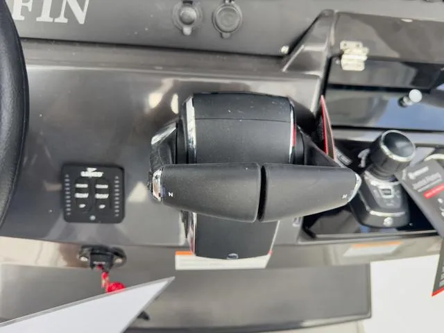 Slide: The Image of Close-up of the 2024 Blackfin 272 CC boat control panel. - 36