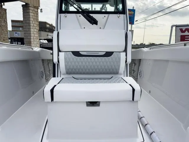 Slide: The Image of 2024 Blackfin 272 CC boat interior with cushioned seating and storage. - 44