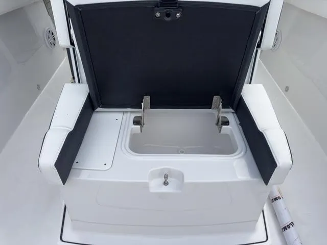 Slide: The Image of 2024 Blackfin 272 CC boat seating with storage compartment open. - 45