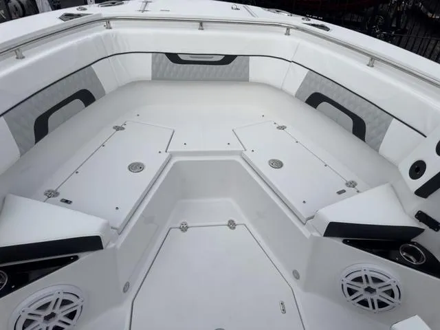 Slide: The Image of 2024 Blackfin 272 CC boat interior with spacious seating and storage compartments. - 49