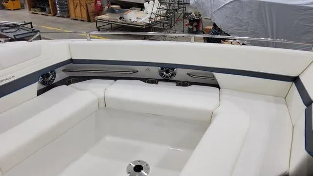 Slide: The Image of 2023 Formula 380 SSC boat interior with white seating and cup holders. - 10