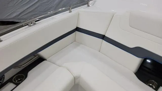 Slide: The Image of 2023 Formula 380 SSC boat interior with white leather seating and blue accents. - 11