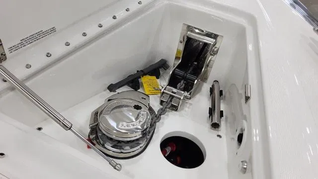 Slide: The Image of 2023 Formula 380 SSC boat anchor compartment with winch and chain. - 13