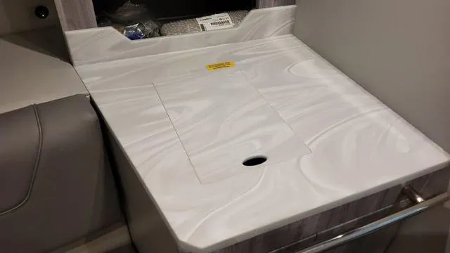 Slide: The Image of 2023 Formula 380 SSC interior countertop with integrated storage compartment. - 19