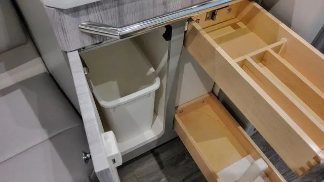 Slide: The Image of 2023 Formula 380 SSC interior storage compartments and trash bin. - 20